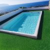 Piscina-prefabricada-elevada-4x2-fija-Candela-en-terraza-frente-al-mar